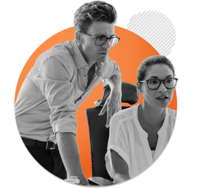 Two people working together on a project black and white cutout against orange circle